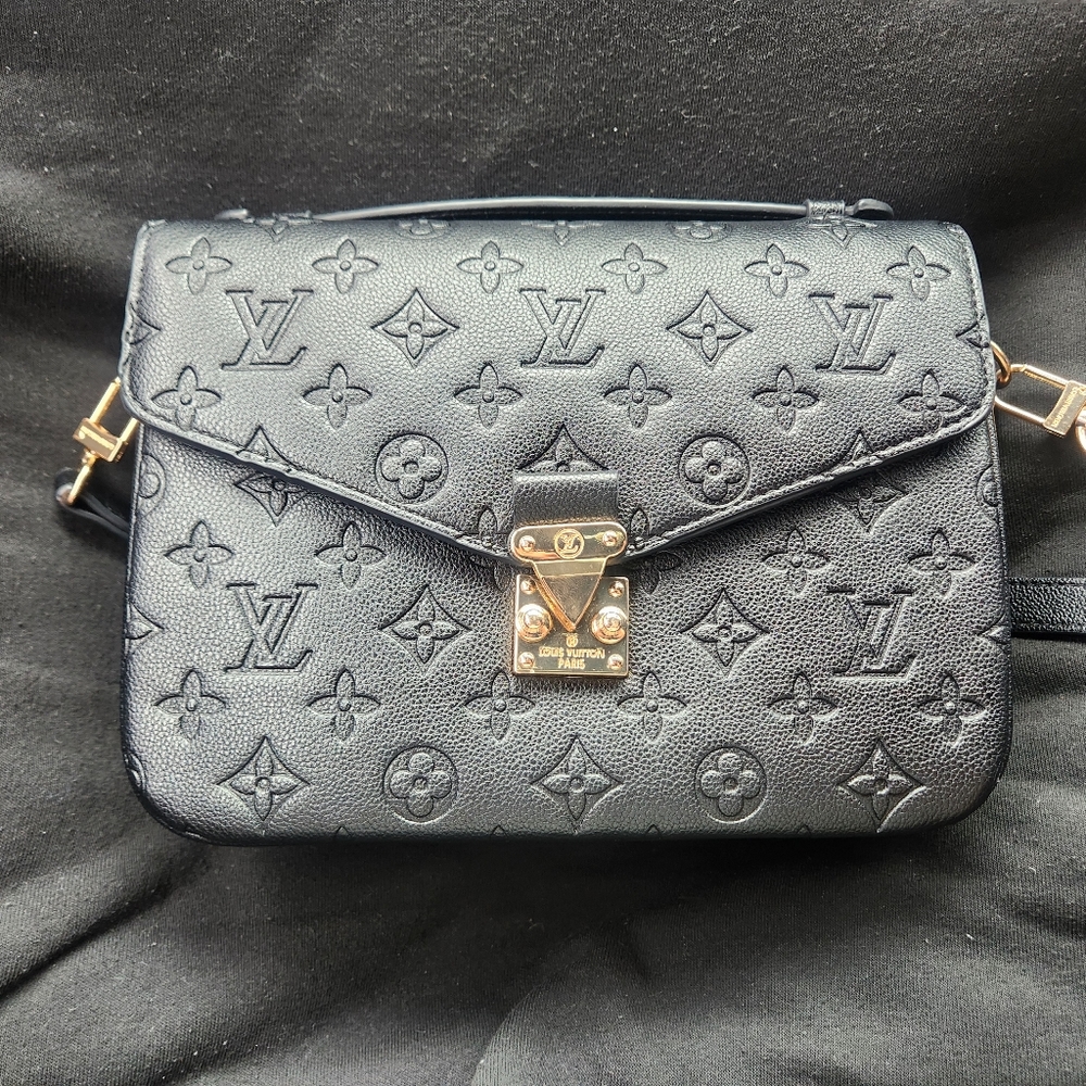 New black Louis Vuitton purse 1900 retail is 2800